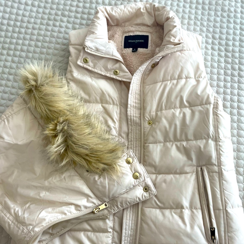 Warm lined winter white vest with faux fur lined hood. Size small.
